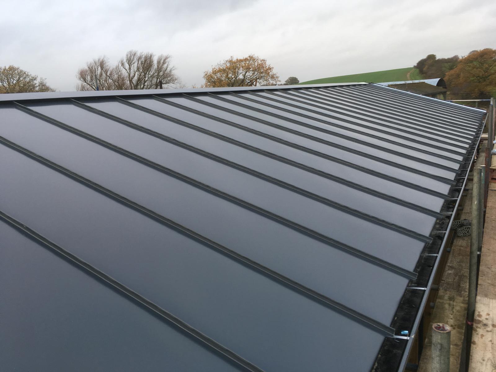 Close-up of a newly installed standing-seam commercial roof