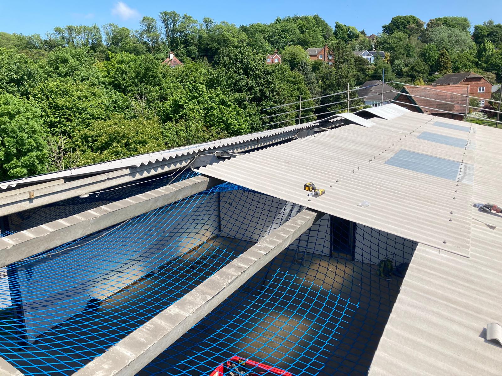 Aerial view of an industrial roof showing safety netting installed for working at height